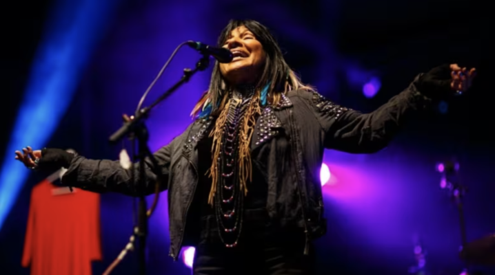 Buffy Saint-Marie performing on stage.